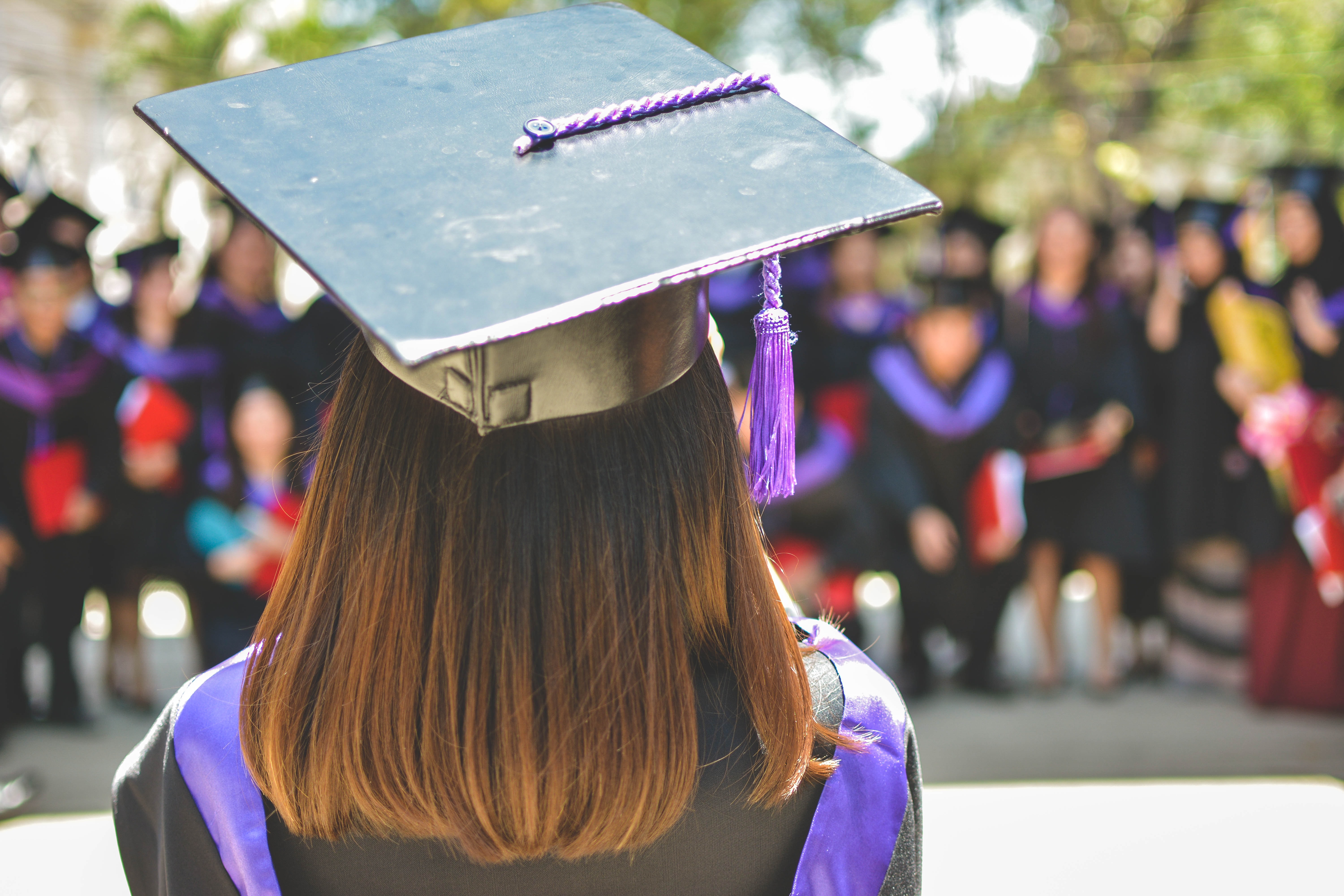 Young graduate with her hat